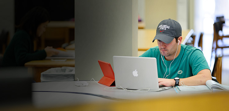 A student working on a laptop