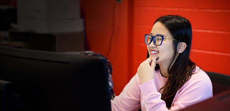 A student working on a computer station