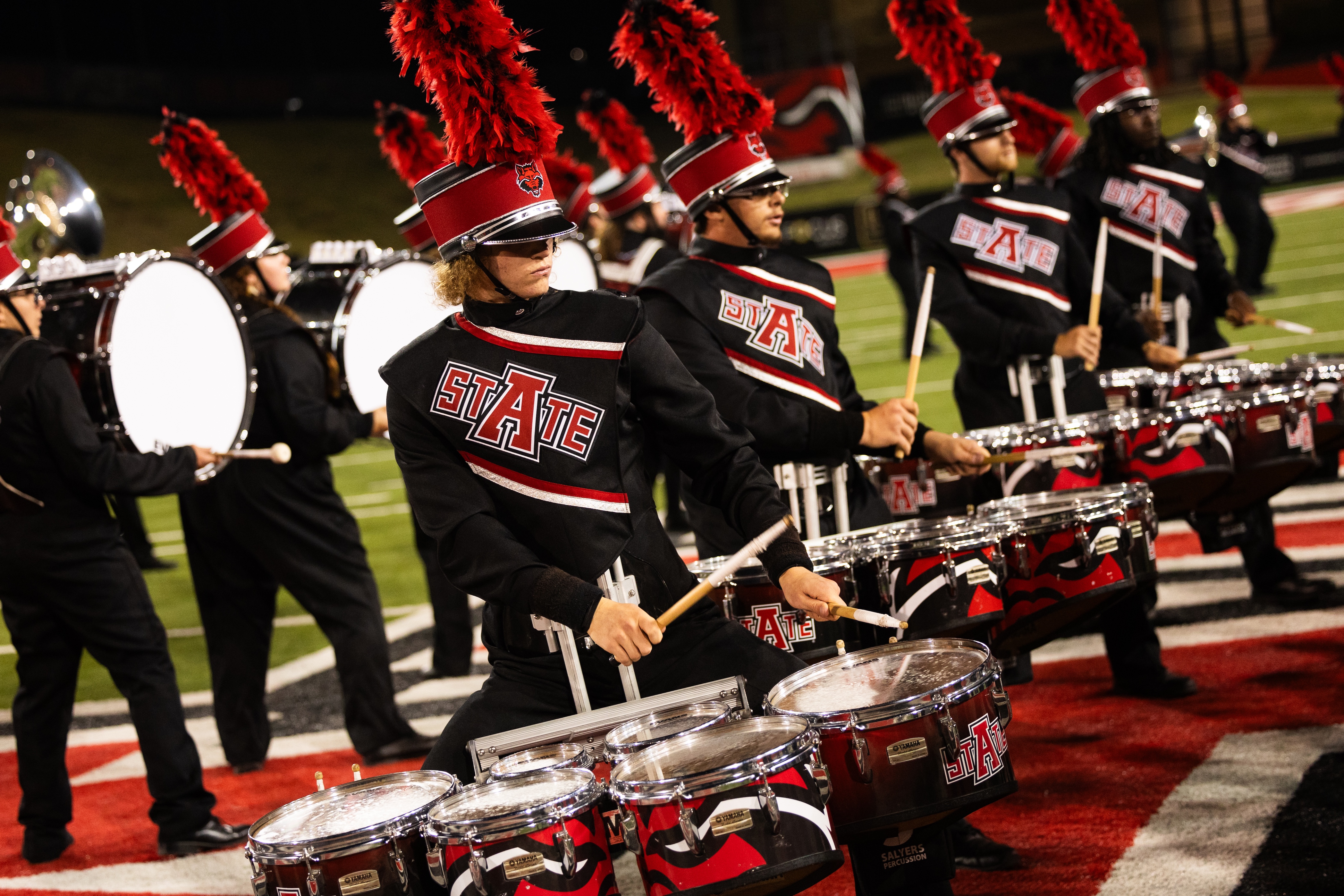 Marching band drum line in black A-State uniforms