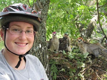 Sarah Miller in a tree with birds